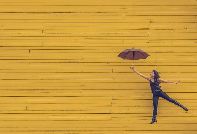 Woman with floating umbrella. How to get users to download your app.